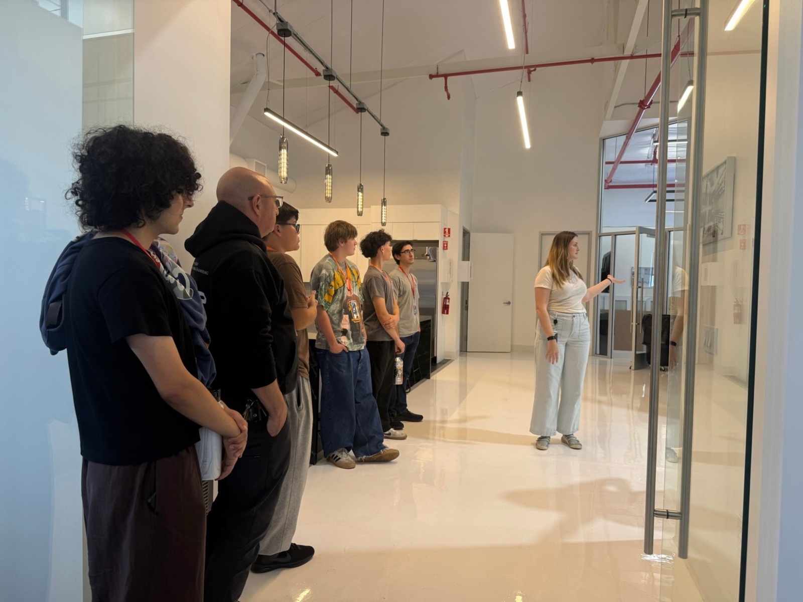 Students on a guided tour inside an aerospace startup's offices