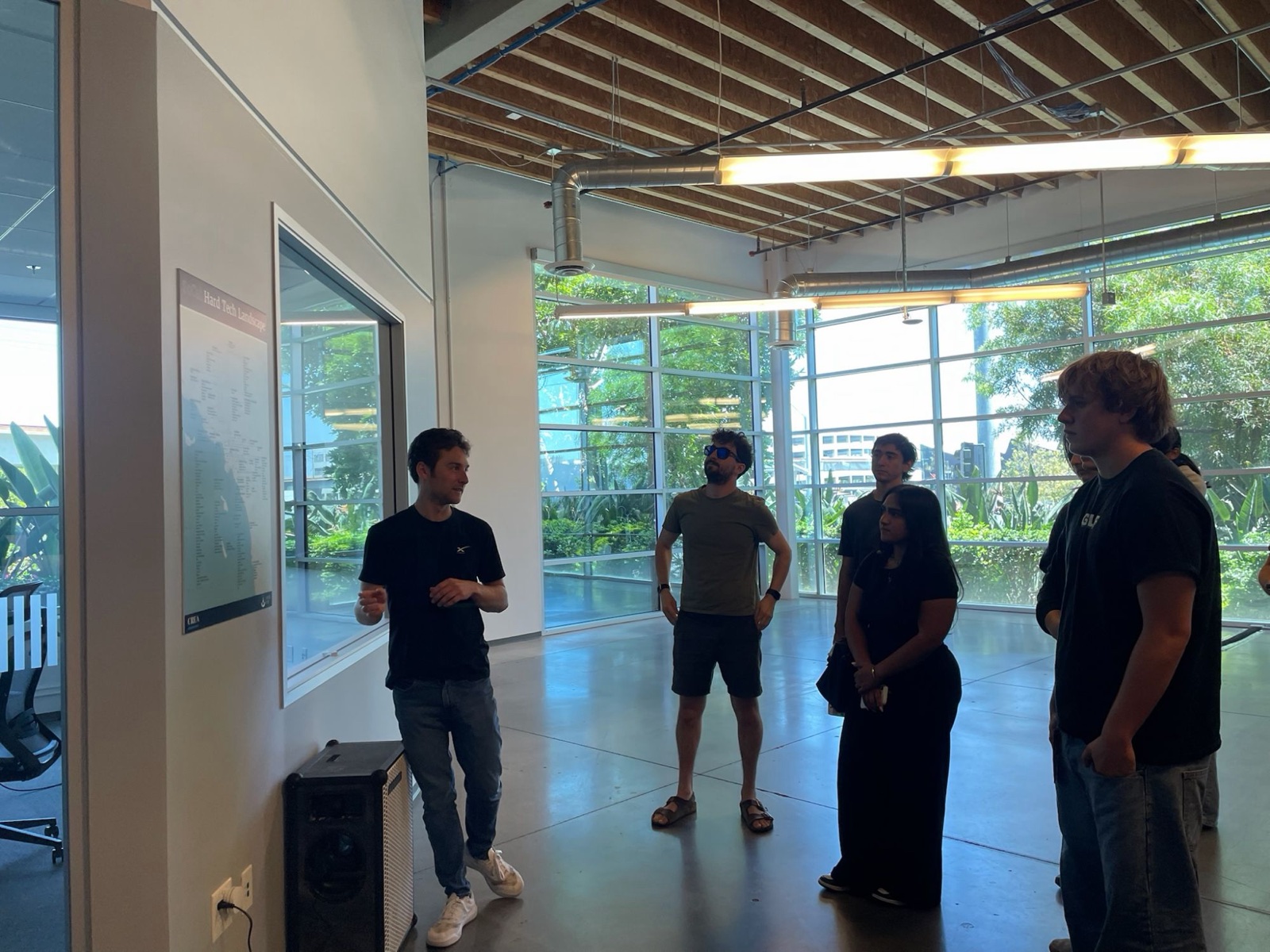 An engineer walking students through a map of LA's hard tech companies