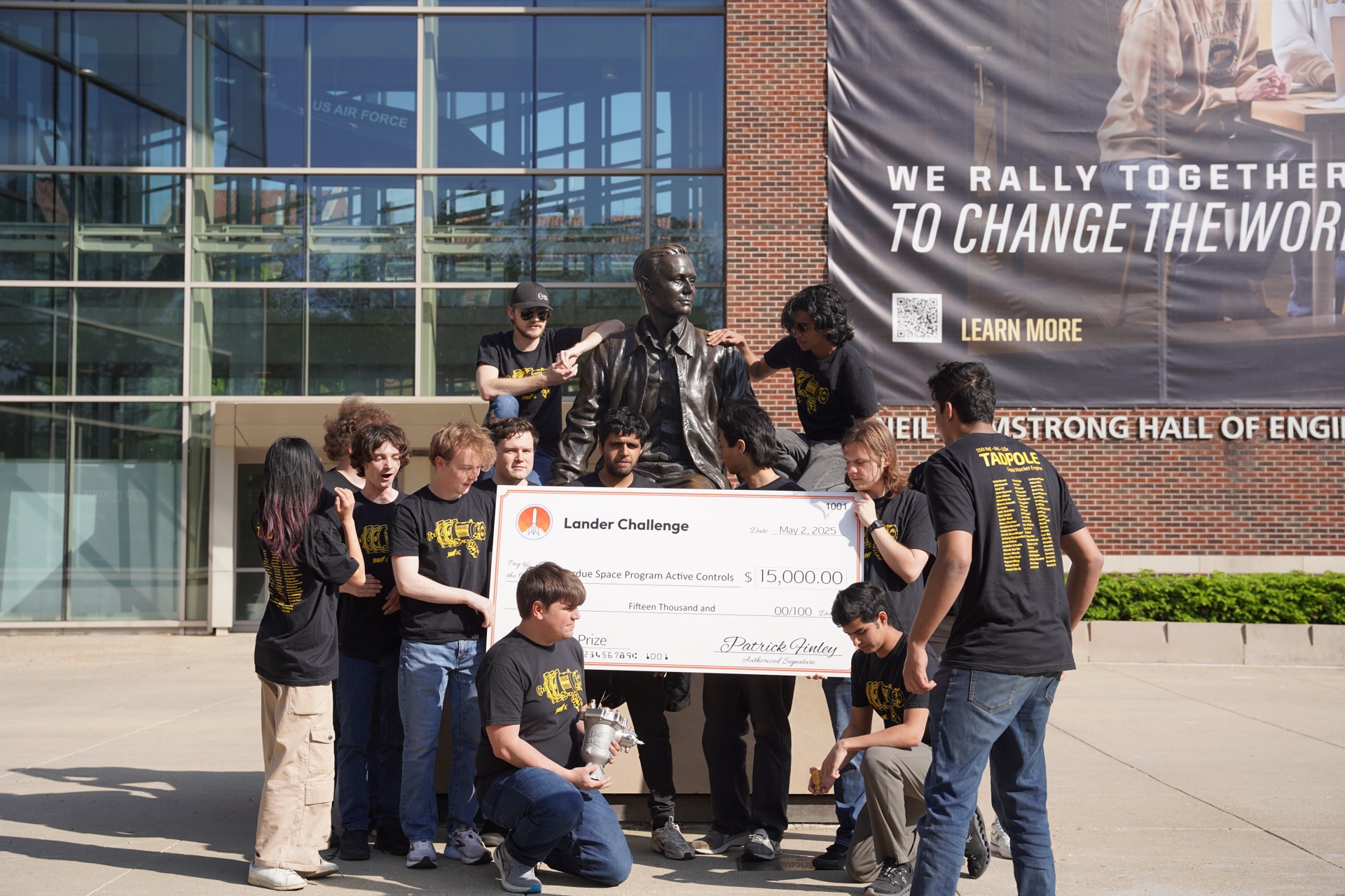 Lander Challenge team holding a $15,000 prize check at Neil Armstrong Hall of Engineering