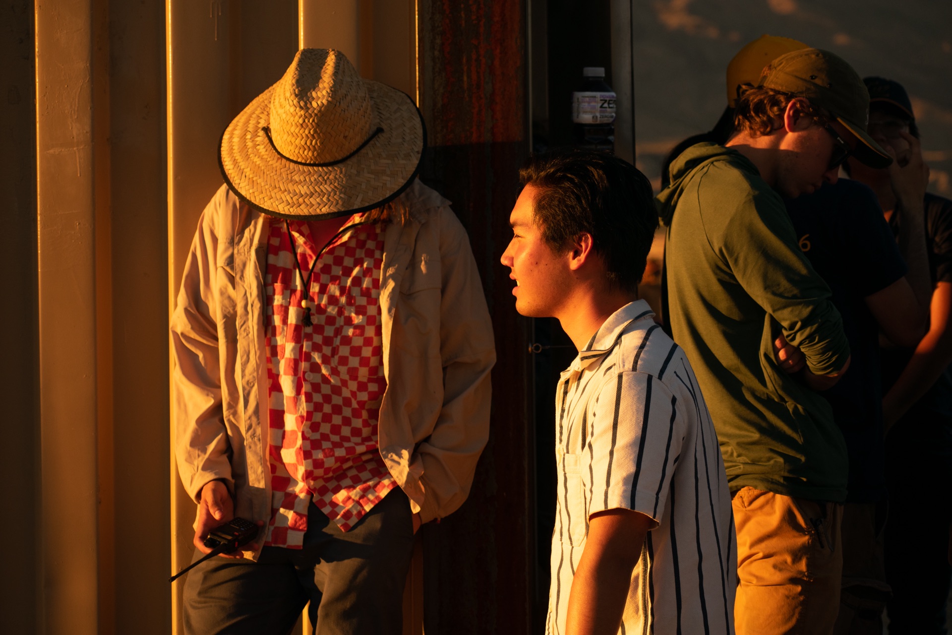 Students talking at the launch site at golden hour